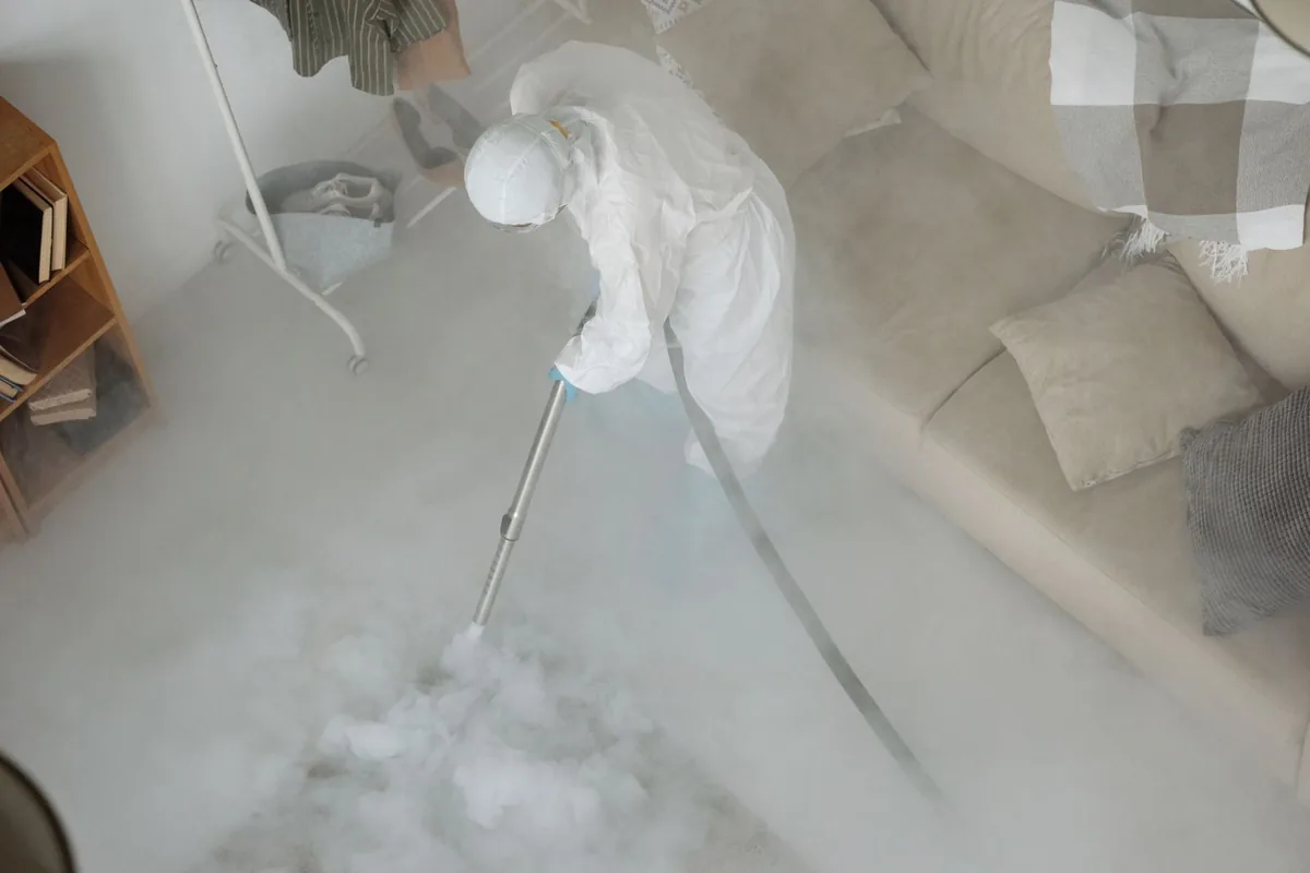 Biohazard cleanup technician in protective equipment, Waller, TX